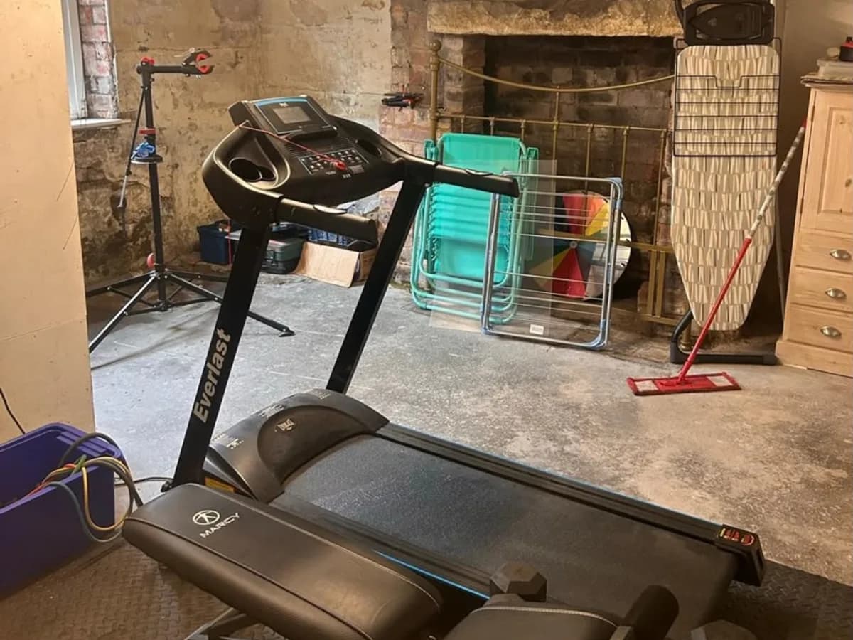 Leeds basement room used for storage and gym equipment with bare walls before conversion